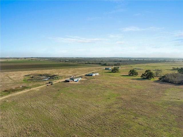 birds eye view of property featuring a rural view