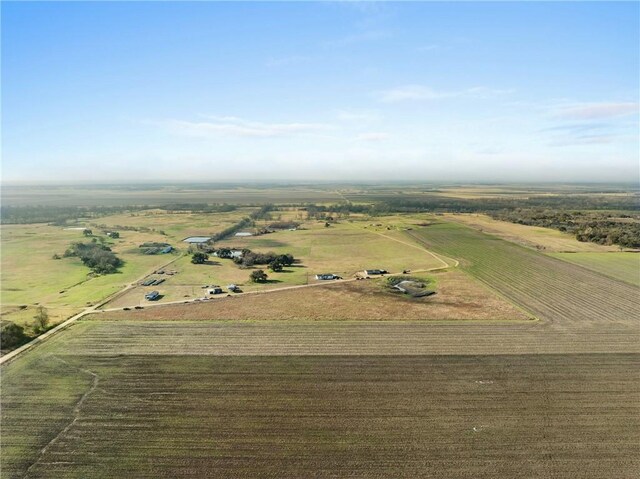 birds eye view of property with a rural view