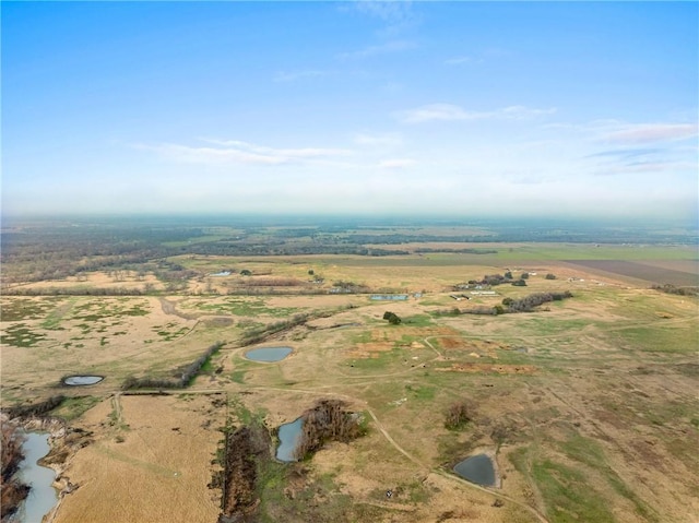 drone / aerial view with a rural view and a water view