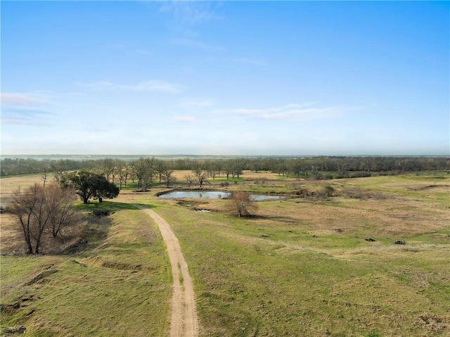 bird's eye view featuring a water view and a rural view