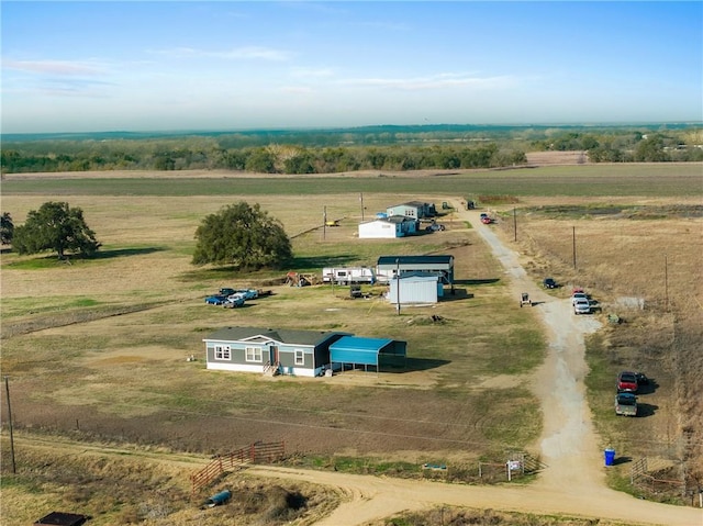 birds eye view of property with a rural view