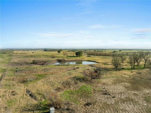 exterior space featuring a rural view and a water view