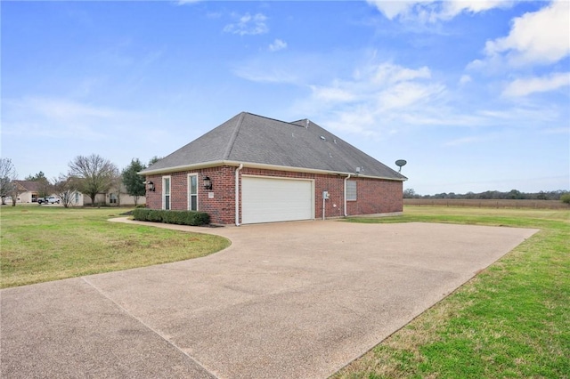 view of side of property with a lawn