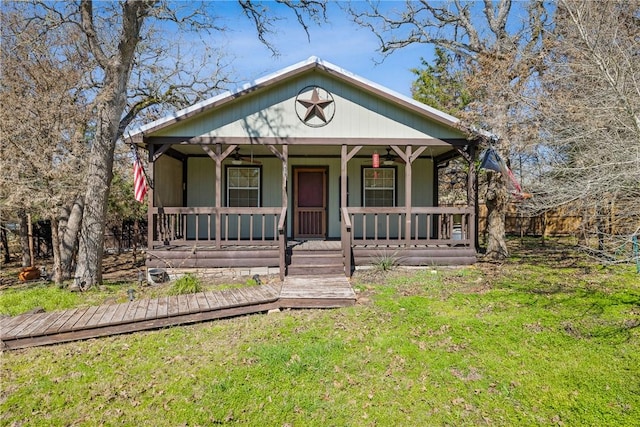 view of front of property with a porch and a front lawn