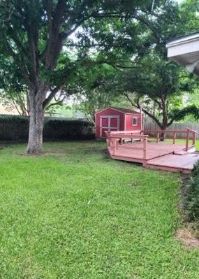 1706 Shawnee St, Navasota, TX 77868 - view of yard with a deck