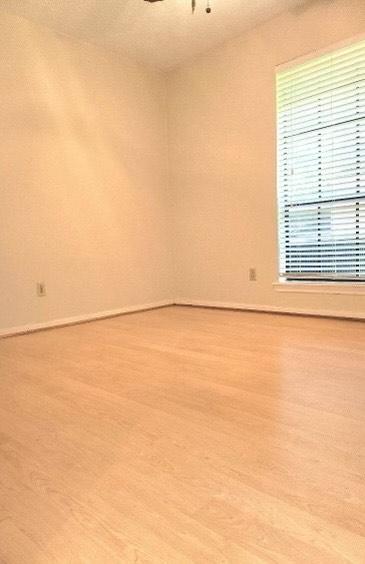 1706 Shawnee St, Navasota, TX 77868 - unfurnished room with light wood-style flooring and baseboards