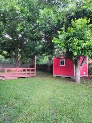 1706 Shawnee St, Navasota, TX 77868 - view of green lawn with an outbuilding