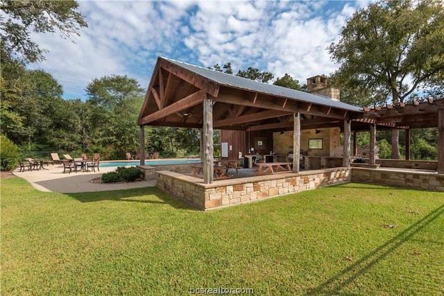 view of property's community featuring a pergola, a pool, a yard, and a patio