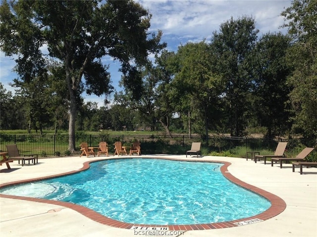 view of swimming pool with a patio