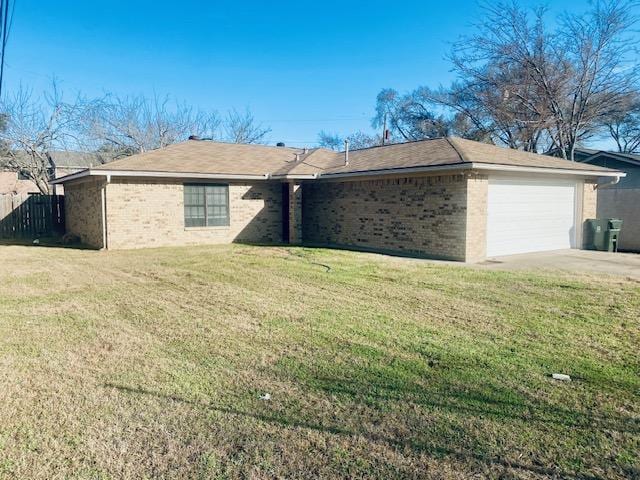 ranch-style home with a garage, brick siding, fence, concrete driveway, and a front lawn