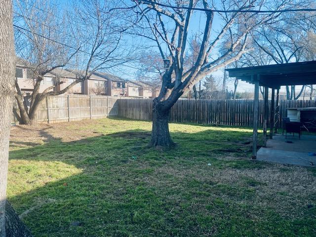 view of yard featuring a patio area and a fenced backyard