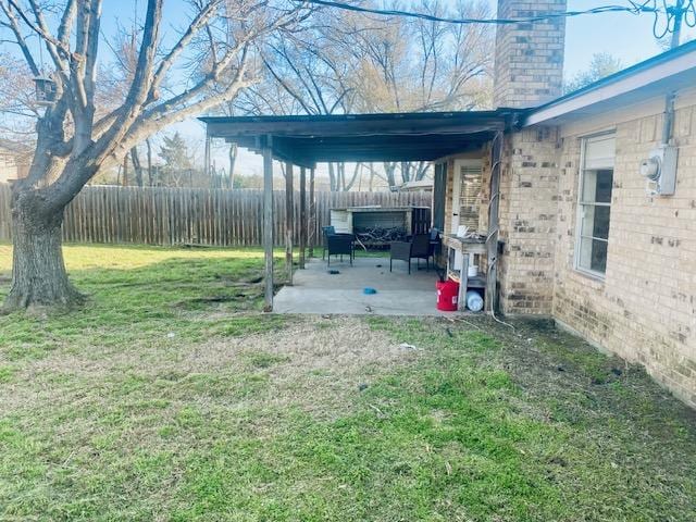 view of yard with a patio area and a fenced backyard