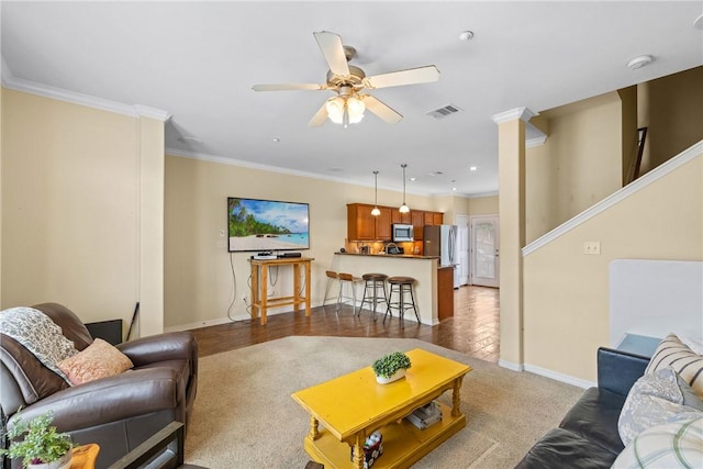 living area featuring recessed lighting, a ceiling fan, baseboards, and ornamental molding