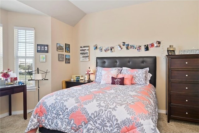 carpeted bedroom with vaulted ceiling