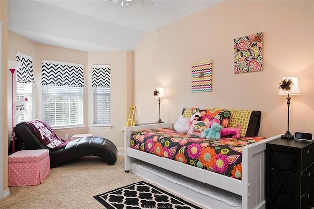 carpeted bedroom featuring vaulted ceiling and ceiling fan