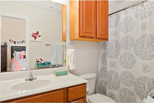 bathroom with vanity and toilet