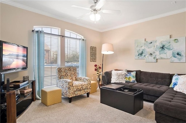 carpeted living room featuring ceiling fan and ornamental molding