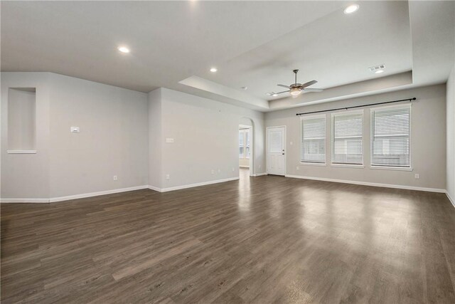 4706 Coyotillo Way, Bryan, TX 77807 - unfurnished living room with a raised ceiling, a ceiling fan, dark wood-type flooring, and recessed lighting