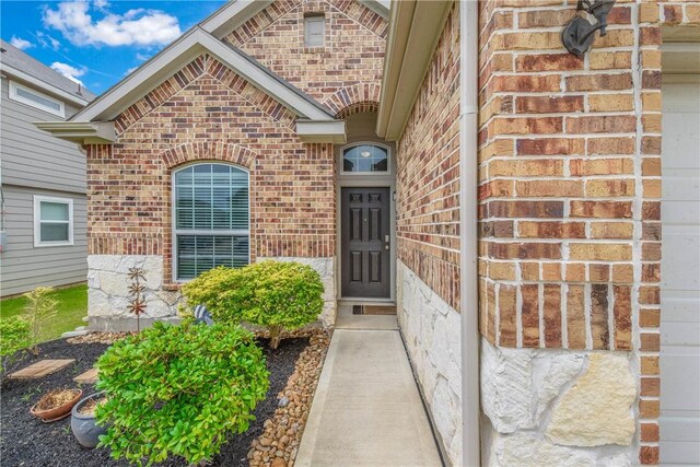 4706 Coyotillo Way, Bryan, TX 77807 - view of exterior entry featuring brick siding