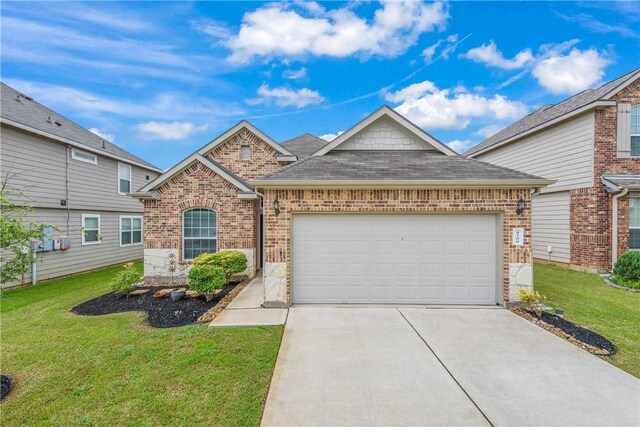 4706 Coyotillo Way, Bryan, TX 77807 - view of front of house with driveway, an attached garage, brick siding, a front lawn, and roof with shingles