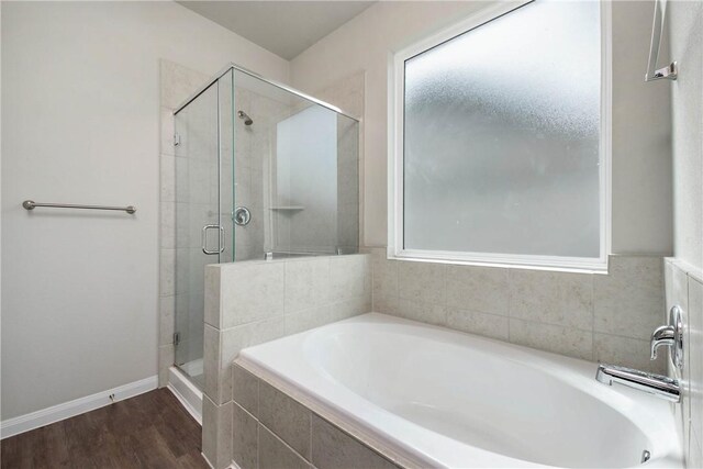 4706 Coyotillo Way, Bryan, TX 77807 - full bath with a garden tub, a stall shower, and wood finished floors