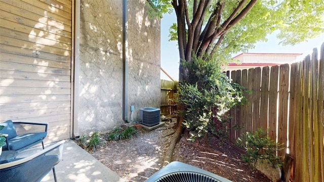 4345 Carter Creek Pkwy Unit 5, Bryan, TX 77802 - view of property exterior featuring central AC and fence