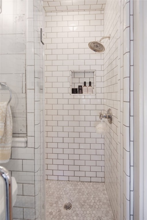 bathroom with a shower stall