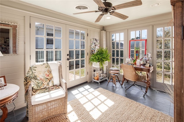 sunroom / solarium with french doors, visible vents, and ceiling fan