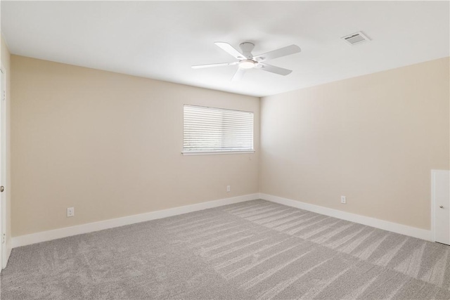 unfurnished room featuring carpet and ceiling fan