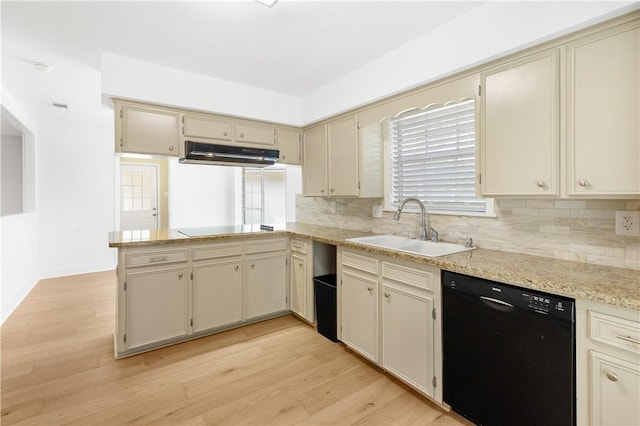 kitchen featuring cream cabinetry, sink, light hardwood / wood-style flooring, and black appliances