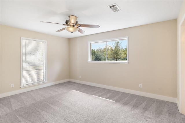 carpeted empty room with ceiling fan