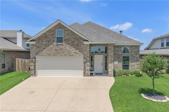 view of front of house featuring a front yard and a garage