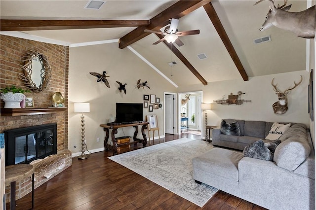 living area with visible vents, dark wood-style floors, and ceiling fan