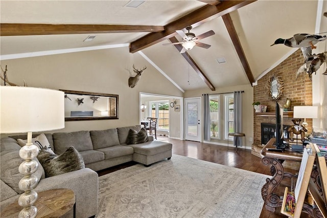 living area with high vaulted ceiling, a ceiling fan, wood finished floors, a brick fireplace, and beam ceiling