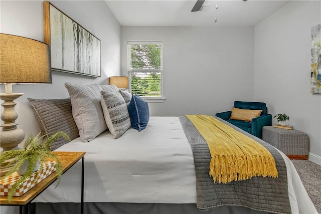 9868 Albert Dr, Iola, TX 77861 - carpeted bedroom with baseboards and a ceiling fan