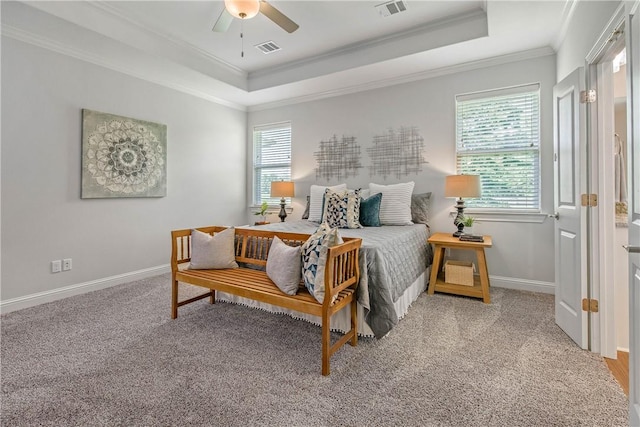 9868 Albert Dr, Iola, TX 77861 - bedroom with a tray ceiling, crown molding, light carpet, and a ceiling fan