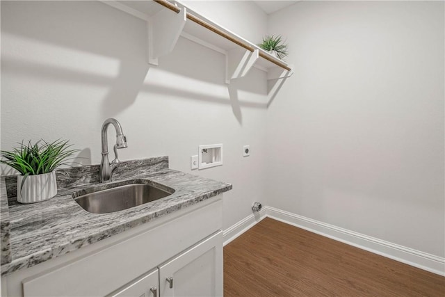 9868 Albert Dr, Iola, TX 77861 - laundry room with washer hookup, hookup for an electric dryer, cabinet space, and dark wood finished floors