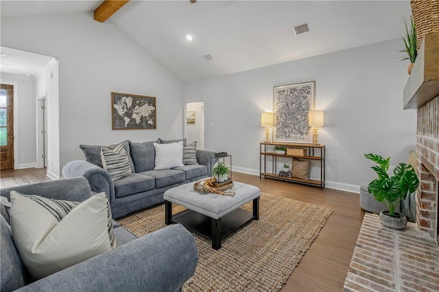 9868 Albert Dr, Iola, TX 77861 - living room featuring a brick fireplace, wood finished floors, and recessed lighting