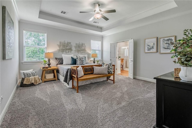 9868 Albert Dr, Iola, TX 77861 - carpeted bedroom featuring a raised ceiling, ornamental molding, a ceiling fan, and connected bathroom