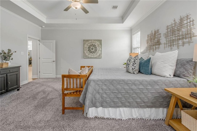 9868 Albert Dr, Iola, TX 77861 - carpeted bedroom with a tray ceiling, ornamental molding, and ceiling fan