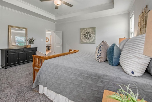 9868 Albert Dr, Iola, TX 77861 - carpeted bedroom with a tray ceiling, crown molding, and a ceiling fan