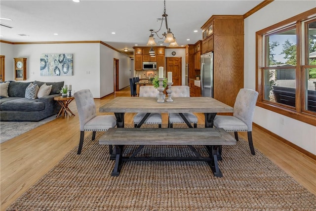 dining room with wood-type flooring and ornamental molding