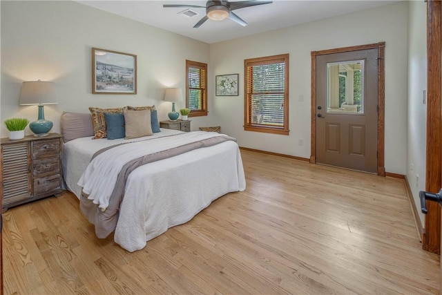 bedroom with ceiling fan and light hardwood / wood-style floors