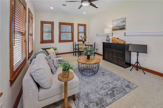 sitting room featuring ceiling fan