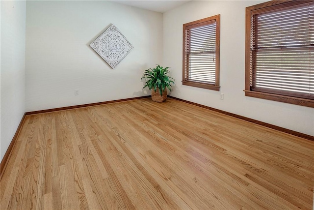 spare room with light hardwood / wood-style flooring