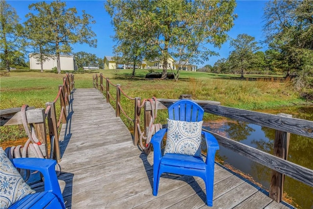 dock area featuring a lawn