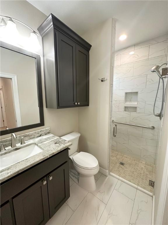 114 Hayes Church Rd, Franklin, TX 77856 - full bath with marble finish floors, a stall shower, vanity, and recessed lighting