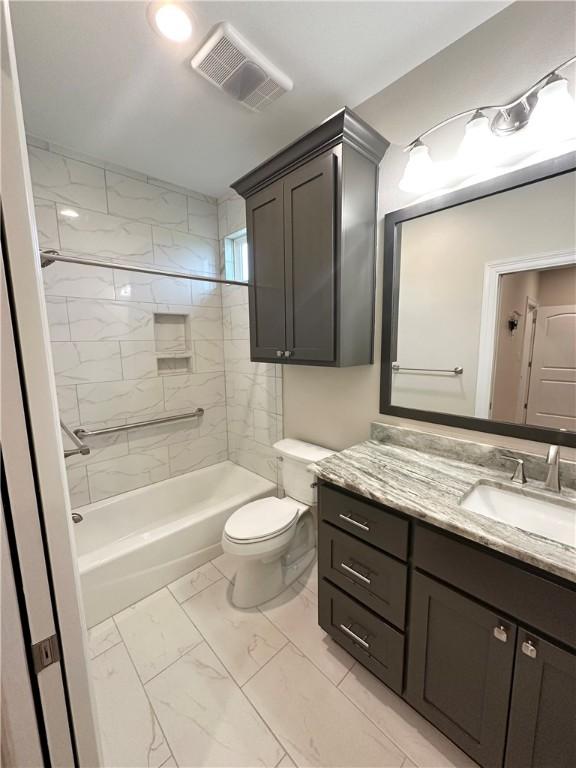 114 Hayes Church Rd, Franklin, TX 77856 - bathroom featuring marble look tiles, vanity, and bathtub / shower combination