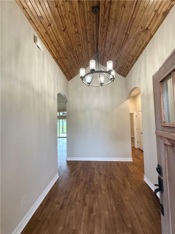 114 Hayes Church Rd, Franklin, TX 77856 - empty room featuring arched walkways, wooden ceiling, a chandelier, dark wood-type flooring, and high vaulted ceiling