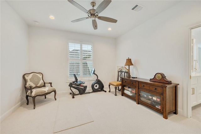 living area featuring light colored carpet, visible vents, baseboards, and recessed lighting